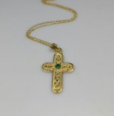 Bynantine Cross necklace made of high-quality 14k gold plated chain and green emerald gemstone. Appropriate for both everyday or special looks. Size of the Cross: 20*27mm Length approx. 15 inches / 38 cm - with 1.2 inch extension. ♥ All items will come in a nice gift box ♥ ★ Read our policies before purchase: https://www.etsy.com/shop/Jewellusion/policy/ ★ Convo me for custom orders or any questions you might have ♥ Visit our shop for more fabulous jewels: https://www.etsy.com/shop/Jewellusion/ Gold Emerald Jewelry With Engraving, Gold Engraved Emerald Jewelry, Engraved Gold Emerald Jewelry, Engraved Emerald Gold Jewelry, Spiritual Gold Emerald Gemstone Necklace, Gold Emerald Necklace With Gemstone For May Birthstone, Gold Emerald Necklace For May Birthstone Gift, Handmade Green Byzantine Jewelry, Gold-plated Emerald Necklace For May Birthstone