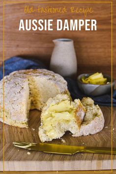 a loaf of bread sitting on top of a wooden cutting board next to a knife