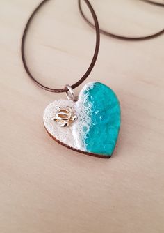 I wanted to capture the beauty of the sea in a pendant, and those incredible sea turtles, which after being born on a beach of fine white sand, follow their first impulse towards the water. The heart is made of wood and resin. It can be personalized with a message on the inside. The earrings have hypoallergenic surgical steel closures. Immerse yourself in summer and wear this mermaid outfit! Mermaid Outfit, Wood And Resin, Summer Necklace, Sea Turtles, White Sand, Summer Jewelry, Earrings Set, Heart Pendant, Jewelry Set