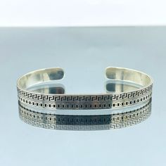 Handmade 925k silver Unisex Bracelet. Make your father, boyfriend, brother and grandfather happy with silver ring designs that reflect medieval and Ottoman era style. Make them feel valuable with such silver rings made of pure silver for birth days and special occasions. Attract attention of people around you with precious stones on silver. * Item weight: 15.5 gr  * Bracelet width: 8 mm * Thank you for looking at my shop. * Also, you may prefer to make yourself feel special. * If you have any questions please send me an e-mail. * Our production time is 3 business day * After purchasing product, it will be sent to you inside gift box. * If you have a sensitive skin, you must definitely wear silver accessories. Bronze products may irritate your skin. * For the products you want to arrive imm Classic Handmade Sterling Silver Bracelet For Anniversary, Handmade Classic Sterling Silver Bracelet For Anniversary, Classic Silver Stamped Bracelets, Classic Sterling Silver Bracelet As Gift, Sterling Silver 925 Stamped Bracelets For Anniversary, Classic Sterling Silver Bangle For Anniversary, Classic 925 Stamped Bangle For Anniversary, Classic Adjustable Sterling Silver Bracelet 925, Classic Sterling Silver Bangle Stamped 925