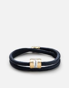 Breeze through your day with the versatile Casing rope bracelet for men. Handmade of maritime nylon rope with a brass barrel featuring a threaded closure. It will make your daily look effortless.[tab]Specifications[/tab]Base Metal: Brass Materials: Maritime Grade Nylon RopeClasp Size: Barrel L: 5/8" W: 3/8"Width: 3/16" Rope Model is wearing a size Medium. Mens Bracelet Designs, Bracelets Style, Minimalist Chain, Gold Pinky Ring, Men's Bracelets, Cuff Watch, Wrist Cuffs, Bracelet For Men, Sterling Silver Mens