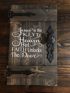 a wooden sign that says jesus is the key to heaven but faith unlocks the door