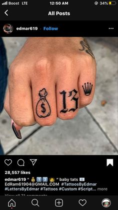 a person's hand with tattoos on it and the number 11 tattooed to their thumb