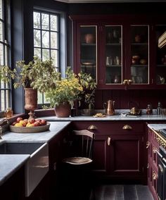 a kitchen filled with lots of counter top space next to a stove top oven and sink