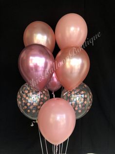 a bunch of balloons that are in the shape of polka dots on a black background