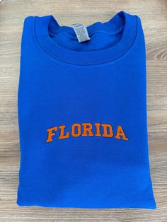 If you want a custom order or have any questions, please message me! -Florida embroidered crewneck -50/50 cotton/polyester -Unisex sizing: fits true to size. Order one size up for a looser fit. Custom Embroidered Crew T-shirt For College, Custom Embroidery Crew T-shirt For College, College Crew T-shirt With Custom Embroidery, Blue Embroidered Crew T-shirt, Blue Crew T-shirt With Custom Embroidery, Blue Crew Neck T-shirt With Custom Embroidery, Custom Embroidery Crew Neck T-shirt For College, Navy Military, Embroidered Crewneck