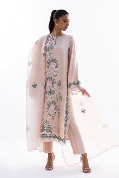 This timeless long shirt silhouette is cut from khaddi silk and is rendered with our signature floral embroidery. An organza dupatta with worked borders and rawsilk trousers complement the look. Designer Tissue Silk Lawn Suit With Intricate Embroidery, Designer Raw Silk Lawn Suit With Chikankari Embroidery, Chikankari Embroidery Raw Silk Lawn Suit For Designer Wear, Designer Organza Lawn Suit With Intricate Embroidery, Silk Lawn Suit With Resham Embroidery, Traditional Drape, Organza Lawn Suit With Intricate Embroidery In Traditional Drape, Silk Lawn Suit With Resham Embroidery, Traditional Draped Lawn Suit With Intricate Embroidery, Organza Lawn Suit With Intricate Embroidery