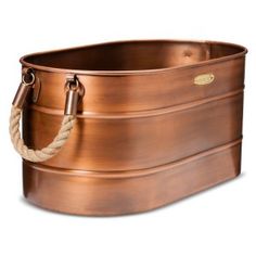 a large metal tub with rope on the handles and bottom, sitting in front of a white background