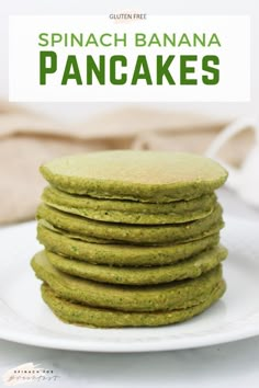 a stack of green pancakes on a white plate with the words spinach banana pancakes