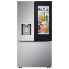 a silver refrigerator freezer sitting next to an icebox filled with drinks and juice