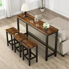 three stools and a table in a living room