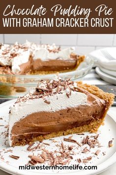 a slice of chocolate pudding pie with graham cracker crust is on a white plate