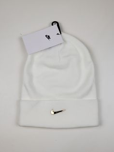 Nike Air Sportswear Metal Swoosh Cuffed Beanie Hat SAIL Metallic Gold One size Breathable Sports Beanie Hat, Warm Sports Beanie Hat, Nike Winter Beanie Hat, Sports Beanie Cap, Solid Winter Sports Hats, Sports Beanie Cap One Size Fits Most, Sports Beanie One Size Fits Most, Nike Casual Winter Hats, Casual Nike Winter Hat