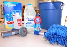 various household cleaning supplies sitting on a counter top with the words, streak free window cleaner