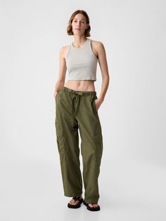 Soft cotton parachute pull-on pants.  Elasticized waist with ribbon drawcords.  Front slant pockets, back flap patch pockets.  Side welt pocket & side cargo pockets.  * Fit: Classic.  An easy silhouette that fits close  at the waist, and is relaxed through the hips and thigh.  Mid rise.  Model is approx.  5’10” wearing Cargo Parachute Pants, Parachute Trousers, Cargo Outfit, Easy Silhouette, Women Cargo Pants, Army Jacket, Buy Buy, Casual Clothes, Photoshoot Outfits