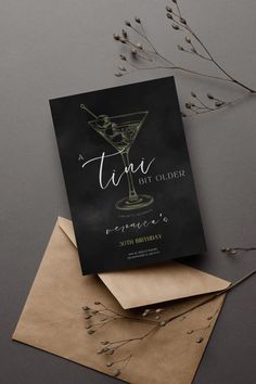 the cover of a book with a martini glass on it and some envelopes next to it