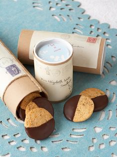 some cookies are sitting on a table next to a cup