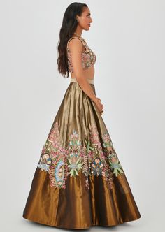 Copper/Gold tissue appliqued and embellished MK lehenga with sleeveless blouse & Scallop dupatta. Anarkali Embellished Sleeveless Choli, Anarkali Style Sleeveless Embellished Choli, Semi-stitched Sleeveless Gown With Resham Embroidery, Sleeveless Semi-stitched Gown With Resham Embroidery, Navratri Reception Sleeveless Gown, Sleeveless Gown For Navratri Reception, Sleeveless Reception Gown For Navratri, Tissue Silk Sets With Floral Embroidery For Reception, Sleeveless Embroidered Wedding Lehenga