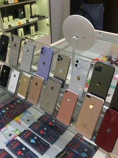 an apple store display with many different colored iphones