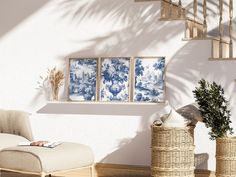 a living room filled with furniture next to a stair case covered in blue and white wallpaper