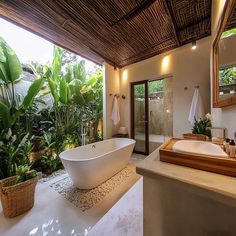 a large white bath tub sitting inside of a bathroom