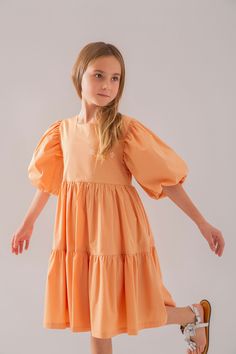 DRESS:%95 COTTON %5 ELASTANE LINING:%100 COTTON Made in Turkey by Monna Rosa Milano. Born from a family-owned passion cultivated over 20 years in the vibrant heart of Turkey, Monna Rosa Milano doesn't just create garments; we craft a legacy of love, quality, and ethical beauty for the discerning child. Why Our Collection Stands Out: Designed with the softest, purest cotton, our clothing line promises to treat your child's skin with the utmost care while keeping them at the forefront of children' Orange Cotton Dress For Spring, Spring Orange Cotton Dress, Orange Cotton Midi Dress With Short Sleeves, Orange Cotton Knee-length Dress, Legacy Of Love, Childrens Clothing Stores, Childrens Clothing, Birthday Dress, Clothing Line