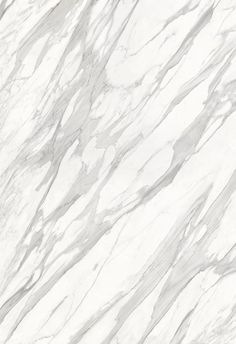 a white marble textured surface with grey streaks