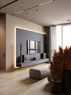 a modern living room with two planters in front of the tv and speakers on the wall