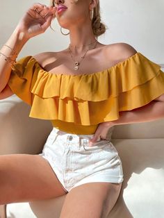 This Casual Off Shoulder Layered Bodysuit is a chic and trendy option for any occasion. The bright yellow color is perfect for adding some sunshine to your wardrobe. It features an off-the-shoulder neckline with a ruffle and tiered layer for added style. The short butterfly sleeves give a feminine touch to the bodysuit. This bodysuit is not sheer, making it easy to wear without any extra layers. Features: Color: Yellow Style: Casual Pattern Type: Plain Neckline: Off the Shoulder Details: Ruffle, Butterfly Sleeve, Butterfly Sleeves, Yellow Fashion, Bright Yellow, Yellow Color, Off Shoulder Blouse, White Shorts, Off The Shoulder, Off Shoulder