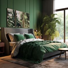 a bedroom with green walls and large windows