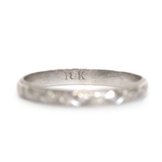 *VIEW A VIDEO OF THIS RING* https://youtu.be/_RwtQa6K4wE This ring can be sized up or down 4 sizes for an additional $30. If you wish to have a ring sized please purchase the item and note the size in the message section. Metal Type: 18K White Gold [Hallmark & Tested] Weight: 2.0 grams Size: 6.5 Finger to Top of Stone Measurement: 1mm Condition: Excellent Payment & Refund Details: *More Pictures Available on Request* Payment via Visa/Mastercard/Discover/AmericanExpress, check, money orde Engraved White Gold Diamond Ring In Platinum, Heirloom Etched Wedding Bands, Engraved Diamond Wedding Ring In 14k Gold, Engraved Wedding Diamond Ring In 14k Gold, Engraved Silver Diamond Wedding Ring, 14k Gold Etched Wedding Rings, Etched 14k Gold Wedding Rings, Timeless Wedding Bands With Diamond Cut, Etched 14k Gold Rings For Weddings