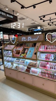 a display case in a store filled with cosmetics