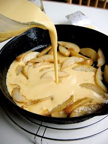 a pan filled with food sitting on top of a stove