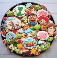 a platter filled with lots of decorated cookies