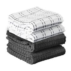 three towels stacked on top of each other in black and white colors, one is folded over the other