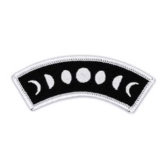 an embroidered patch with phases on the front and back of it, in black and white