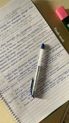 a pen sitting on top of a piece of paper