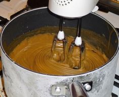 a large metal pot filled with liquid on top of a stove