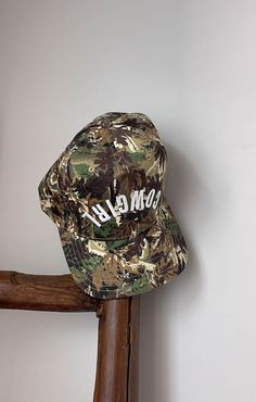 Our new camo Reverse Cowgirl hat features a white thick puff embroidery to really make it stand out. With an adjustable strap in the back it is one size fits all. This is the perfect touch for your next country concert outfit. All hats are final sale. Casual Camouflage Trucker Hat With Flat Brim, Adjustable Camouflage Hat For Summer, Camouflage Trucker Hat One Size Fits Most, Camouflage Trucker Hat One Size, Military Style Baseball Cap For Summer, Summer Military Snapback Hat, Adjustable Camouflage Trucker Snapback Hat, Summer Military Style Snapback Hat, Hip Hop Style Outdoor Hat