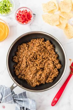 the ingredients to make this taco salad are in bowls