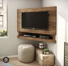 a flat screen tv mounted to the side of a wall