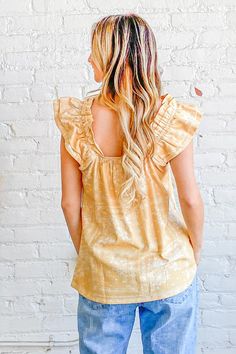 Flutter into spring in style with this bohemian dream of a top. Its cotton blend fabric feels featherlight against your skin as you sway in the warm breeze. Delicate ruffles and an empire waist give it an ethereal quality, while the square neckline and short flutter sleeves keep it flirty. Whether you're dancing at a music festival or strolling through the Saturday market, this top moves with you. Let the vibrant print transport you to exotic lands as you pair it with cutoffs for a casual look o Rachel Clark, There She Goes, Styling Guide, Flutter Sleeve Top, Boho Print, New Inventory, Printed Linen, Top Sales, Flutter Sleeves