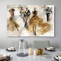 an abstract painting on the wall above a dining room table with place settings and utensils