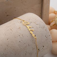 Custom Name Bracelet Gold 14k, Dainty Name Bracelet, Layering Bracelet, Personalize Name Jewelry for Women, Baby Name Bracelet, Gift for Her Materials: High Quality 925 Sterling Silver Finish: 14K Gold Vermeil - A thick layer of 14K gold over high-quality sterling silver. It does not tarnish like gold-plated or gold-filled jewelry. Chain Lengths: *4 inches: Ideal for toddlers or very young children. Perfect for a snug fit on petite wrists. *5 inches: Best for small children, offering a comfortab Elegant Name Bracelet For Gifting, Yellow Gold Adjustable Name Chain Bracelet, Adjustable Yellow Gold Chain Bracelet With Name, Custom Name Yellow Gold Chain Bracelet, Adjustable, Yellow Gold Name Chain Bracelet As Gift, Yellow Gold Name Chain Bracelet Gift, Adjustable 14k Gold Birthday Bracelets, Adjustable 14k Gold Bracelets For Birthday, Adjustable 14k Gold Bracelet For Birthdays