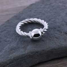 These are a beautiful twist on the classic Cape Cod ring! This coordinates with the twist bracelet, or mix and match with any Cape Cod bracelet. Available in all sterling silver or with a solid 14k yellow gold ball. The back of the bead is flat for a comfortable fit.  **THIS RING FITS 1/2 SIZE LARGE. We recommend order Modern Twist Silver Hypoallergenic Jewelry, Modern Twist Hypoallergenic Silver Jewelry, Hypoallergenic Silver Jewelry With A Modern Twist, Modern Twist Sterling Silver Jewelry In White Gold, Twisted White Gold Jewelry Gift, Modern Twisted Jewelry With Polished Finish, Twisted Polished Jewelry As A Gift, Twisted Modern Jewelry, Modern Twist Sterling Silver Jewelry