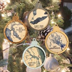 three wooden ornaments hanging from a christmas tree