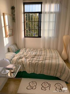 there is a bed in the room with two teddy bears on it and a rug