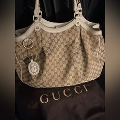 Gucci Sukey , Gucci Hobo, Neutrals Canvas Gg Canvas & Sukey Logo, Gold-Tone Hardware Leather Trim, Rolled Handles, Leather Trim Embellishment, Canvas Lining & Single Interior Pocket, Snap Closure At Top Bags Gucci, Gucci Bags, Leather Trim, Gucci Bag, Leather Trims, Snap Closure, Gold Tones, Handles, Bag Lady