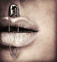 a woman's lips with scissors sticking out of them