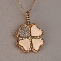 The Luck and Love Clover Gold Pendant is a beautifully designed piece of jewelry that symbolizes good fortune and love. It features a clover-shaped pendant crafted in high-quality gold, with intricate detailing and a shiny finish. The clover is known to symbolize luck, with each leaf representing a different aspect of good fortune - faith, hope, love, and luck. The pendant is also adorned with a heart-shaped centerpiece, symbolizing love and affection. This combination of luck and love makes the pendant a meaningful and sentimental piece to wear or gift to a loved one. The necklace is versatile and can be worn everyday or for special occasions, adding a touch of elegance and charm to any outfit. Overall, the Luck and Love Clover Gold Pendant is a stunning piece of jewelry that carries a po Outfit Overall, Luck Symbol, Love And Luck, Clover Jewelry, Faith Hope Love, Hope Love, Gold Collection, Good Fortune, Faith Hope